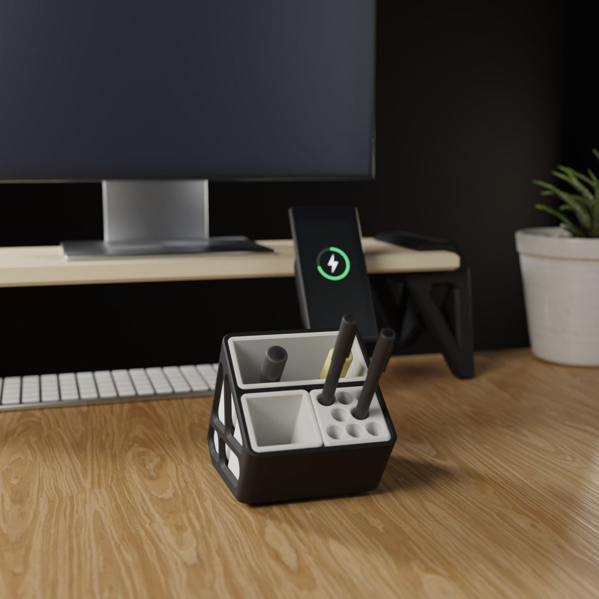 Organiseur modulaire iki devant un bureau équipé : écran, clavier, riser et téléphone en charge